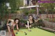 A couple of women playing a game of pool.